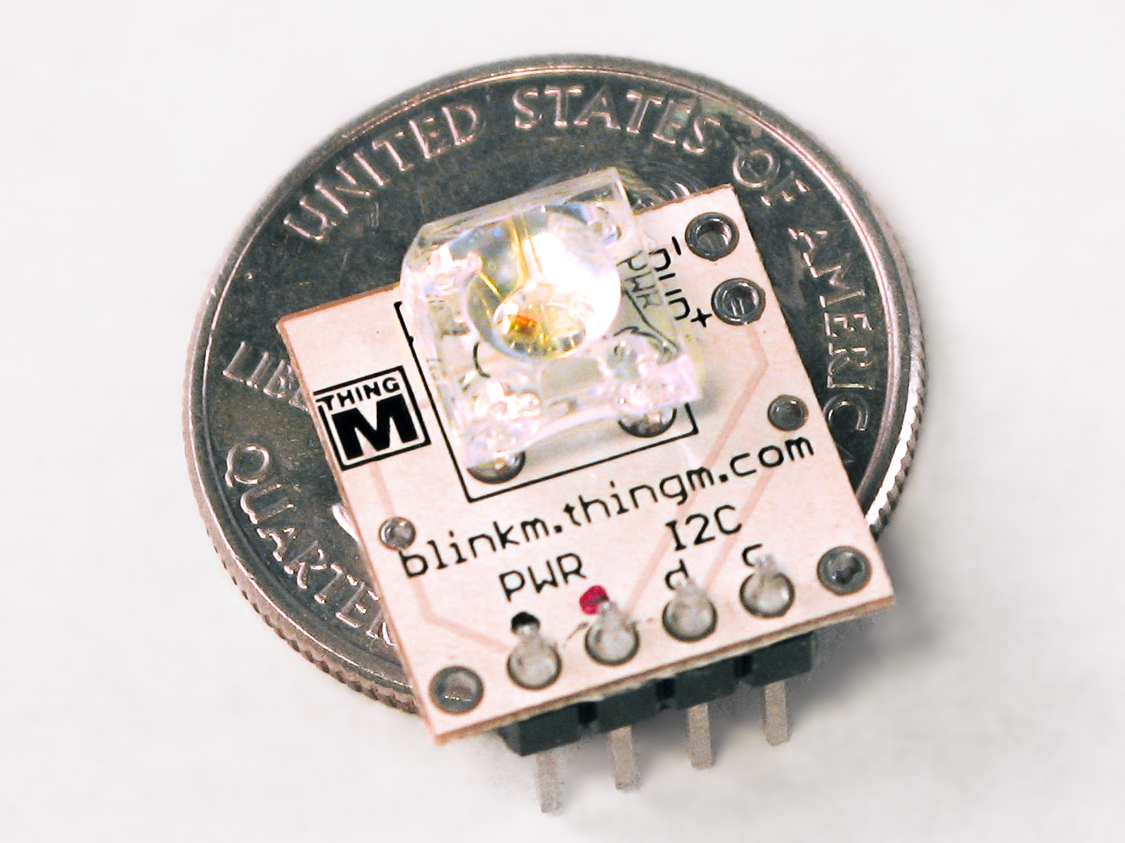 Blink M compared to a quarter